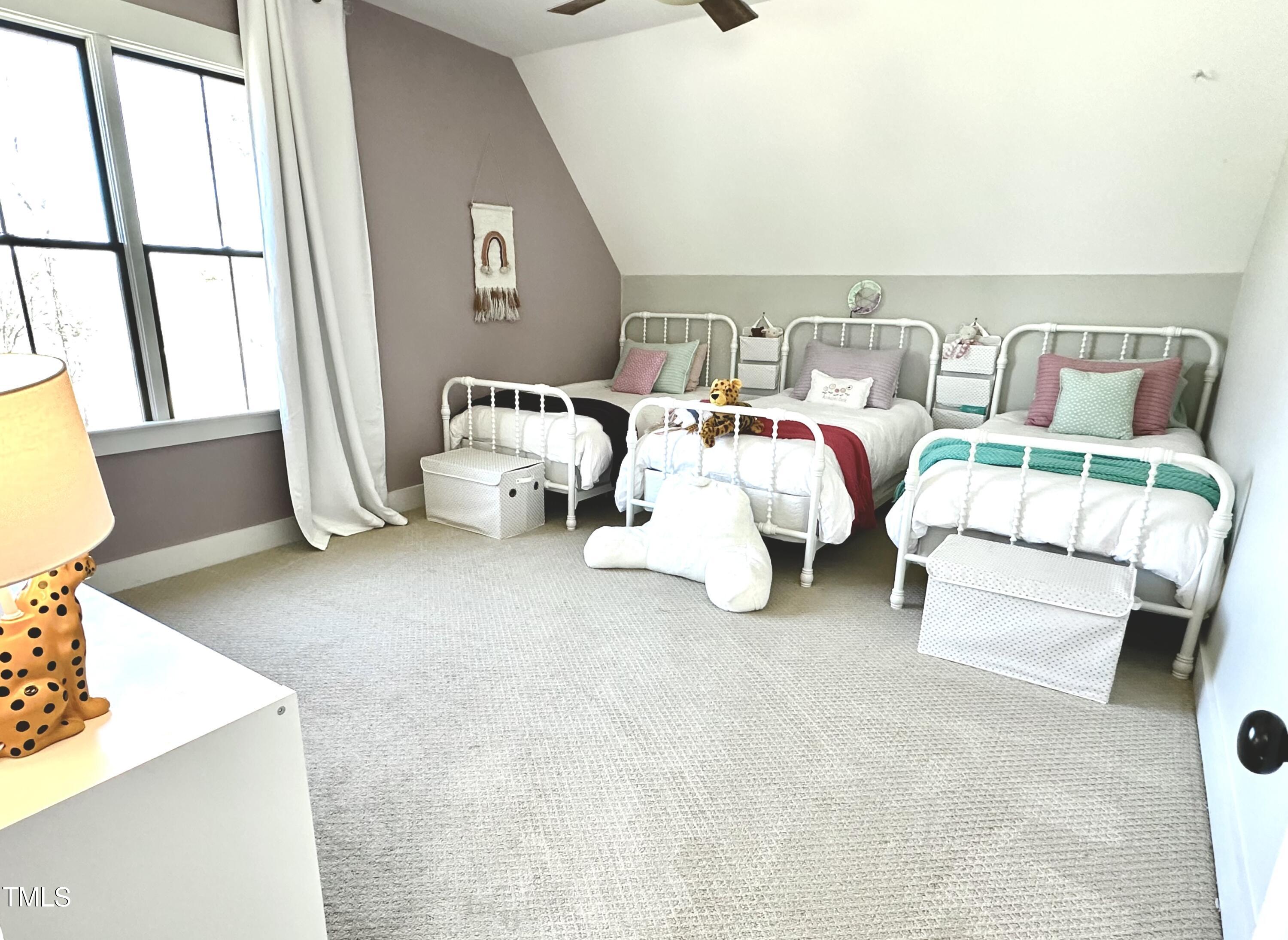 454 Waterville Street Raleigh, NC 27603 - Photo 20 of 25 a bed room with bed and a window