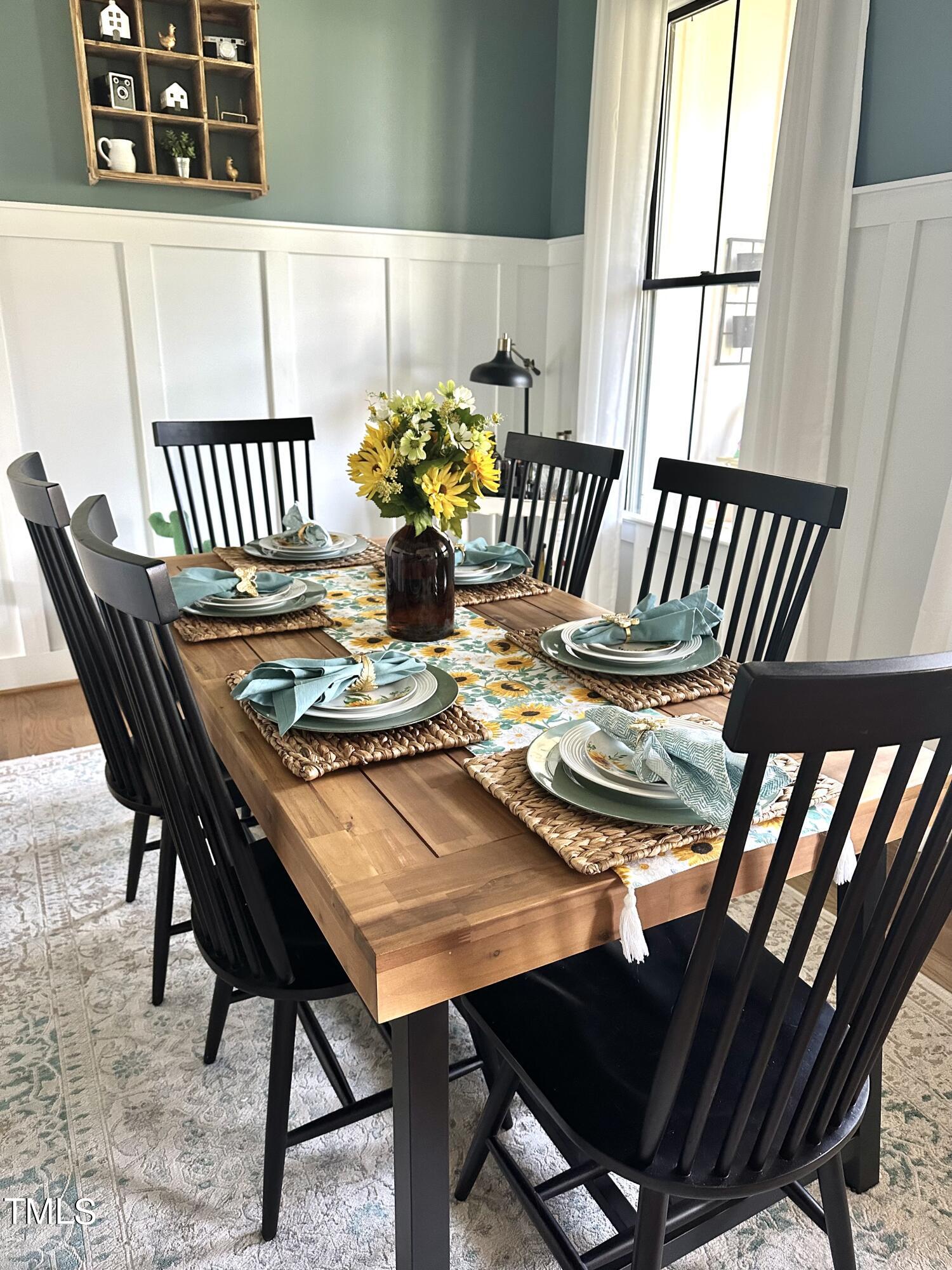 454 Waterville Street Raleigh, NC 27603 - Photo 5 of 25 a view of a dining room with furniture and a window