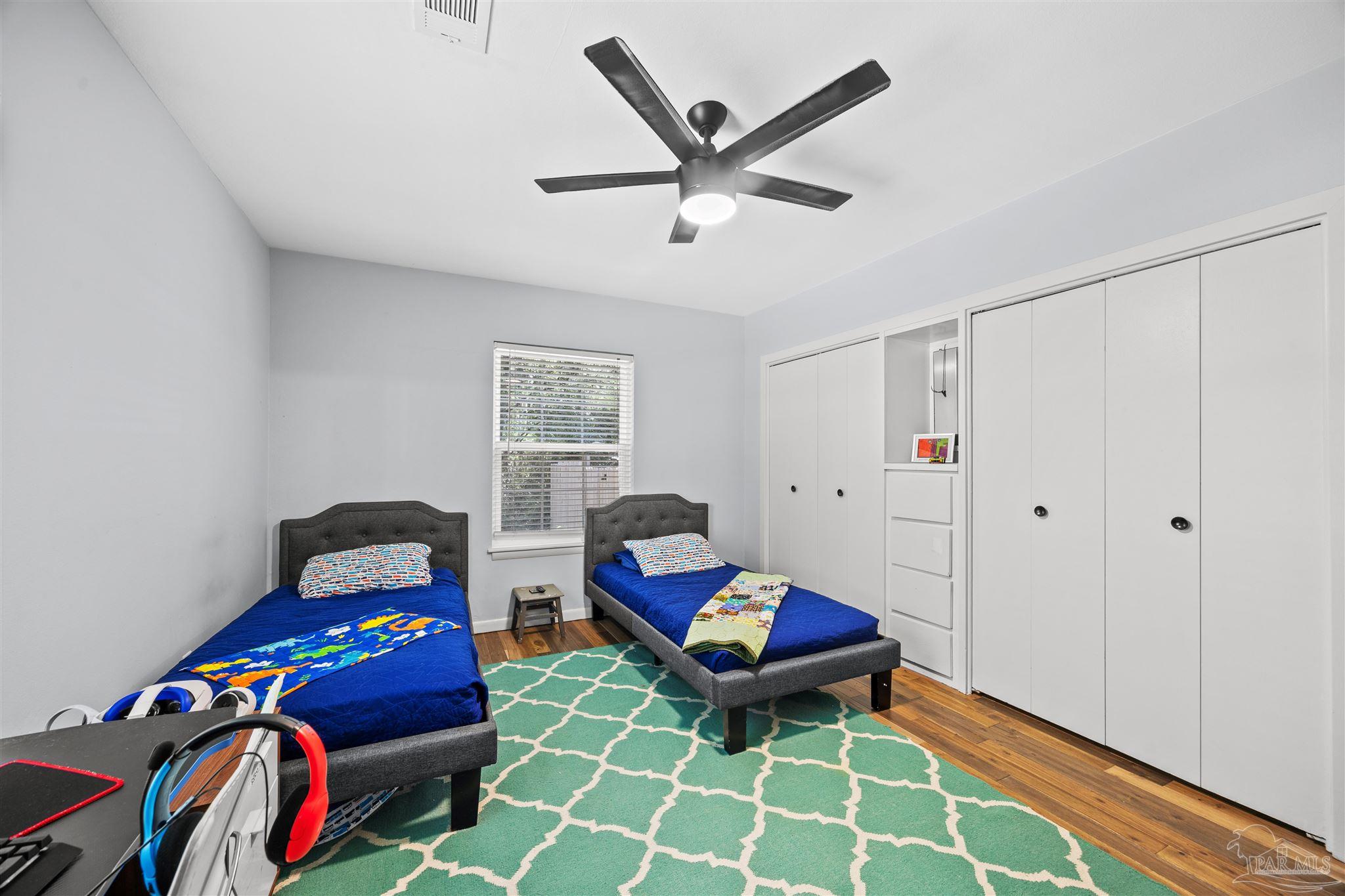 4067 Parkview Street Pace, FL 32571 - Photo 11 of 46 a living room with furniture and wooden floor