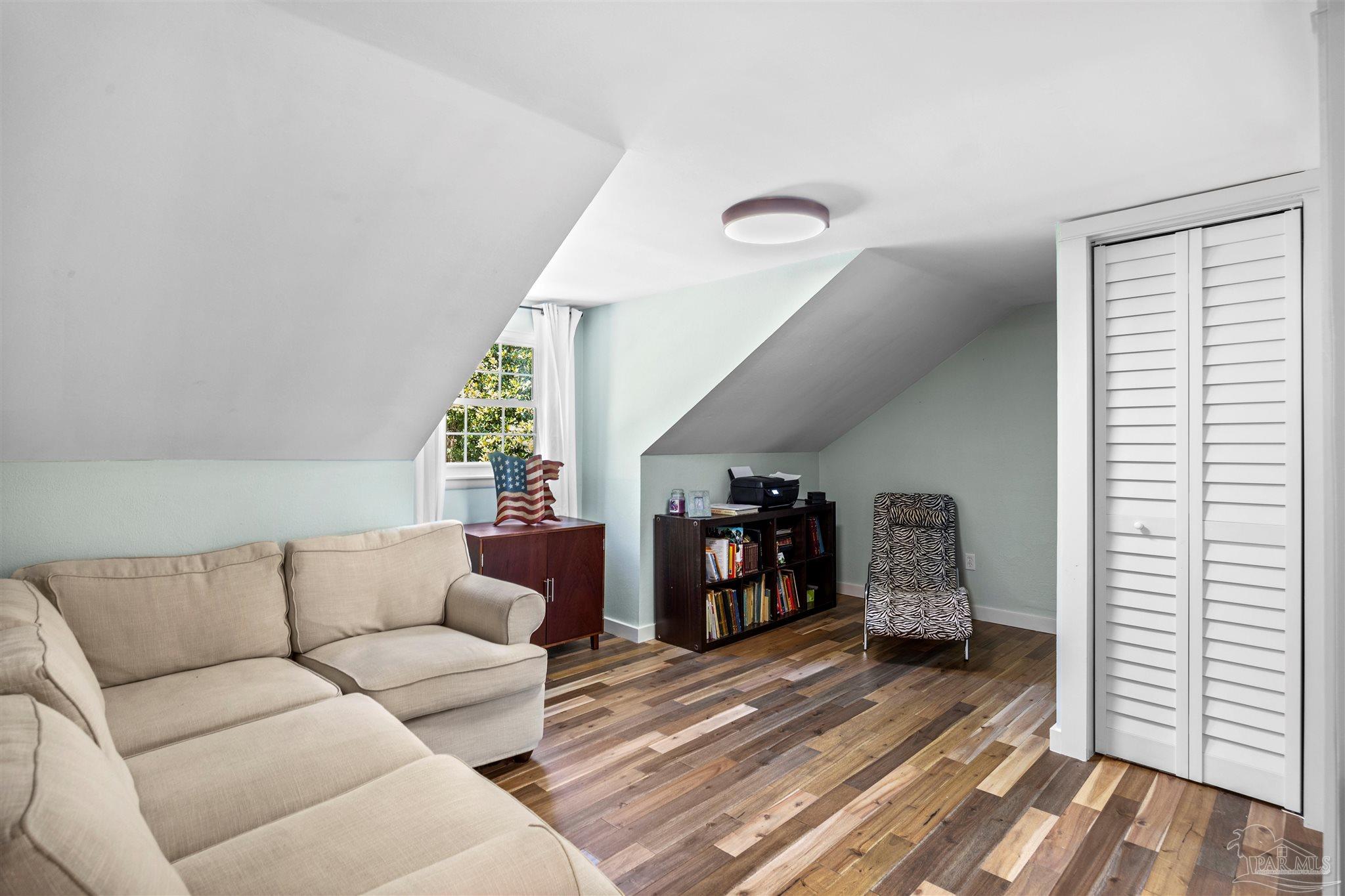 4067 Parkview Street Pace, FL 32571 - Photo 30 of 46 a living room with furniture and a wooden floor