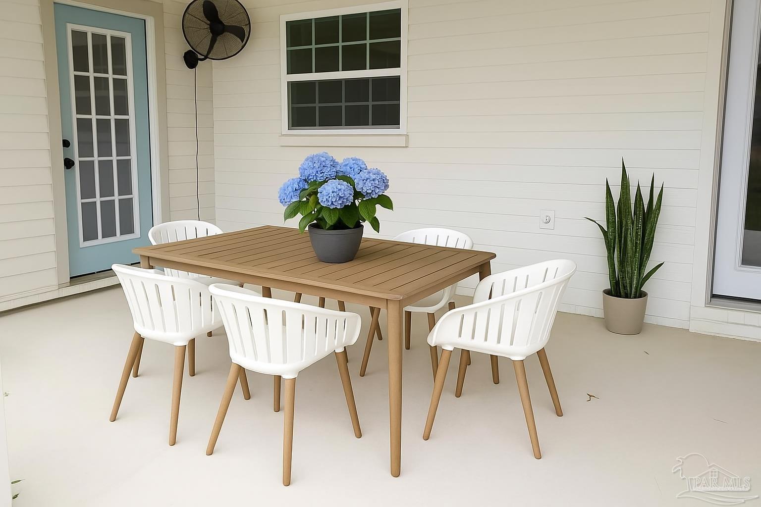 4067 Parkview Street Pace, FL 32571 - Photo 35 of 46 a view of a dining room with furniture and wooden floor