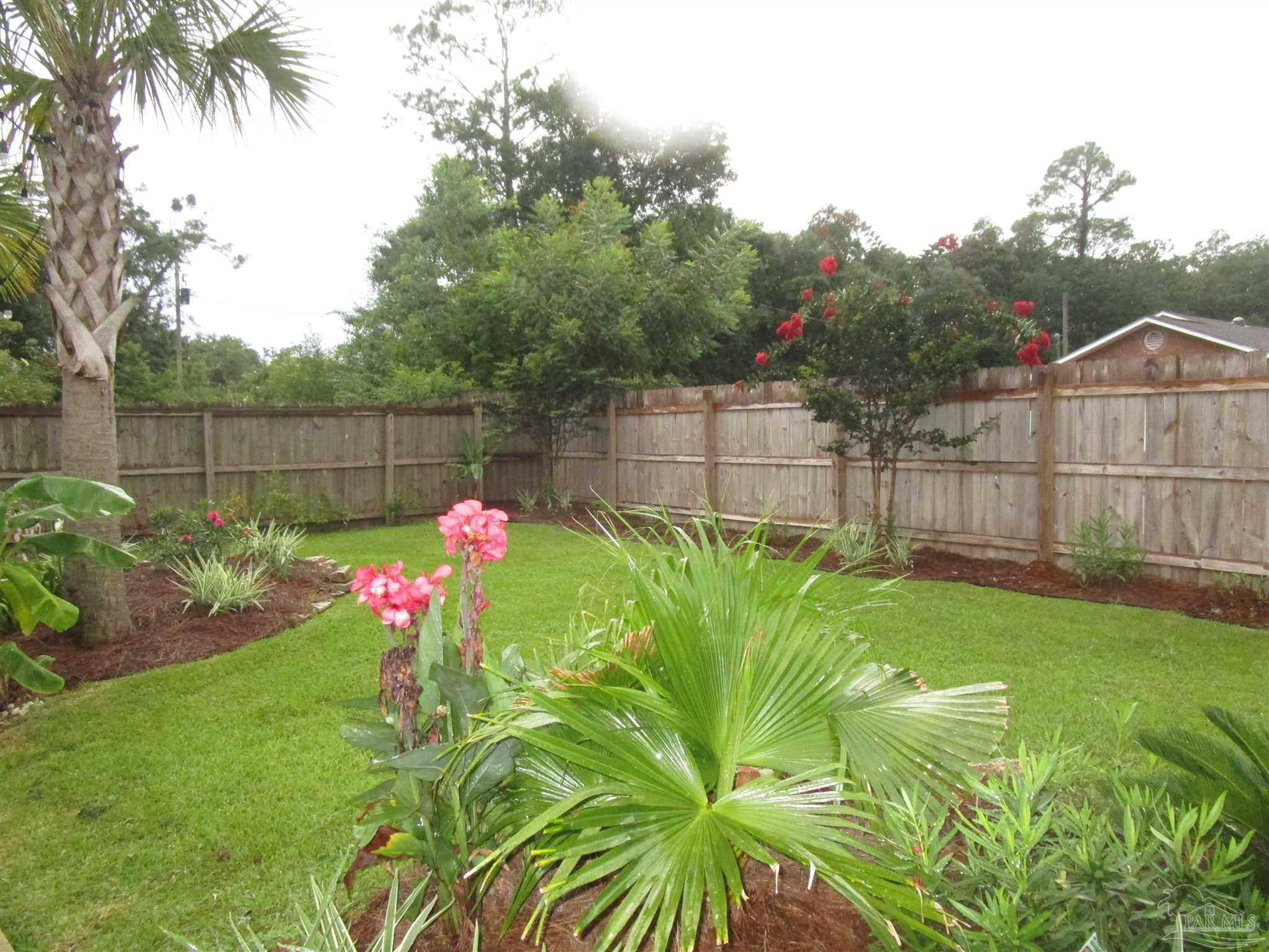 4067 Parkview Street Pace, FL 32571 - Photo 40 of 46 a garden view