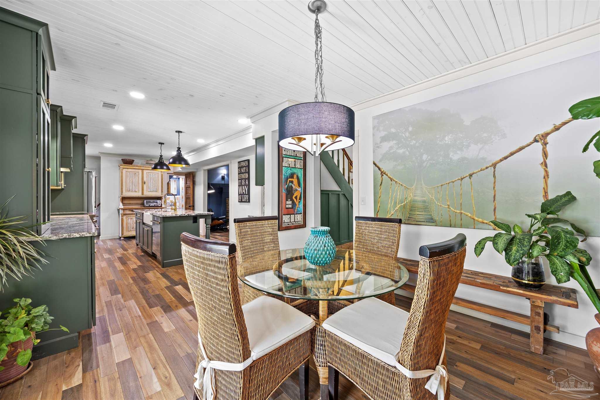 4067 Parkview Street Pace, FL 32571 - Photo 8 of 46 a view of a dining room with furniture window and wooden floor