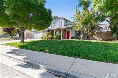 1358 Leopard Court Palmdale, CA 93551 - Photo 1 of 11 a front view of a house with a yard and trees