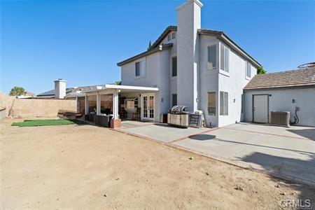 1358 Leopard Court Palmdale, CA 93551 - Photo 11 of 11 a house with yard and a tree