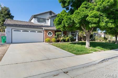 1358 Leopard Court Palmdale, CA 93551 - Photo 2 of 11 a front view of a house with a yard and garage