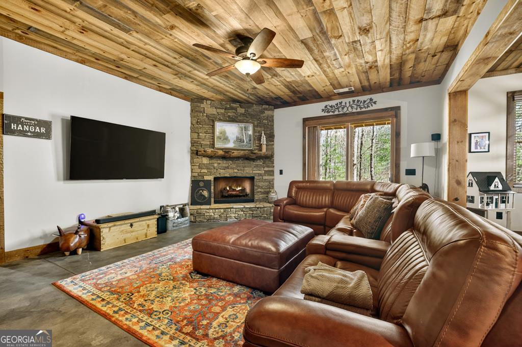 366 Shepherds Lane Morganton, GA 30560 - Photo 29 of 79 a living room with furniture wooden floor and a flat screen tv
