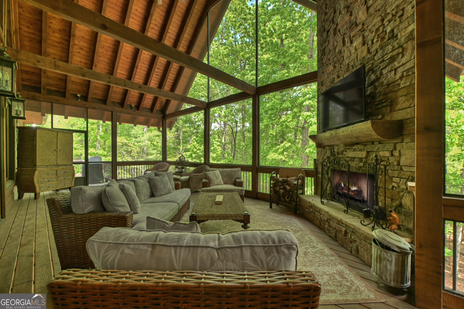 366 Shepherds Lane Morganton, GA 30560 - Photo 53 of 79 a living room with furniture a fireplace and a floor to ceiling window