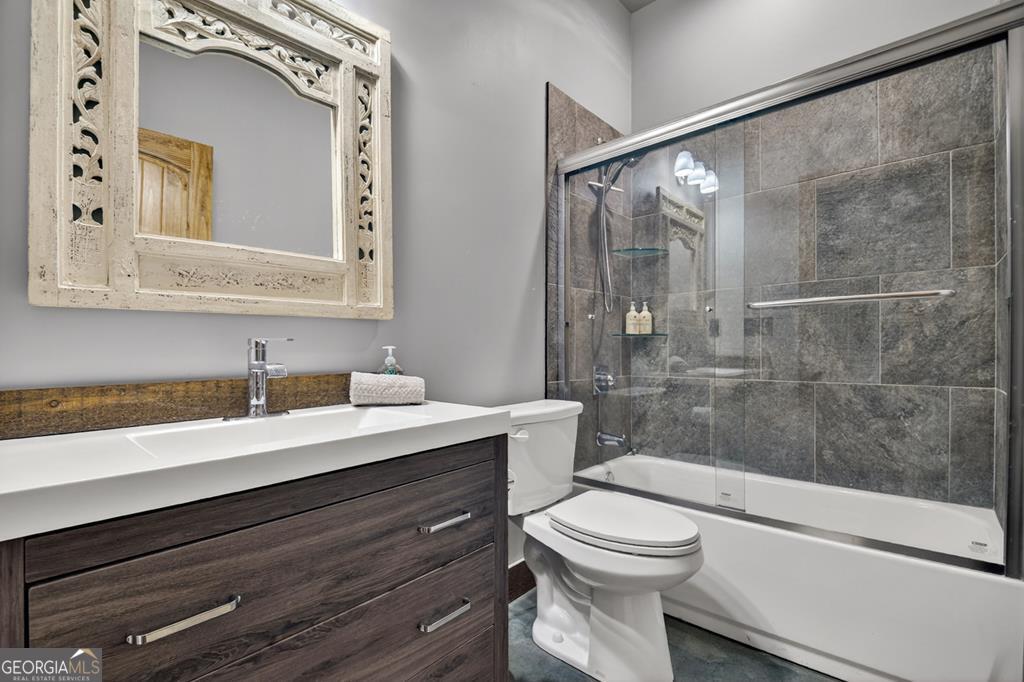 366 Shepherds Lane Morganton, GA 30560 - Photo 65 of 79 a bathroom with a sink a toilet and shower