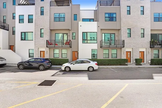 a view of a car parked in front of a building