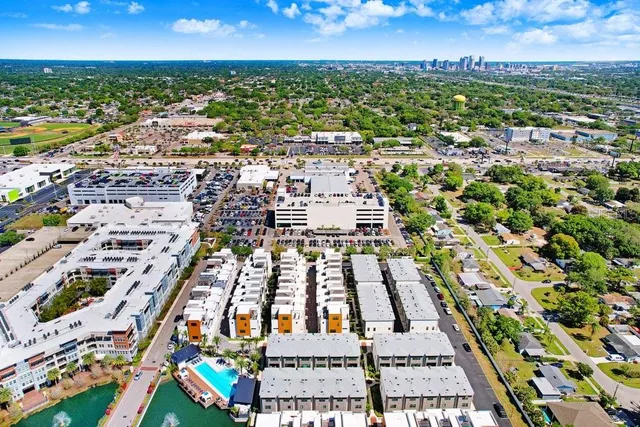 an aerial view of residential houses with outdoor space