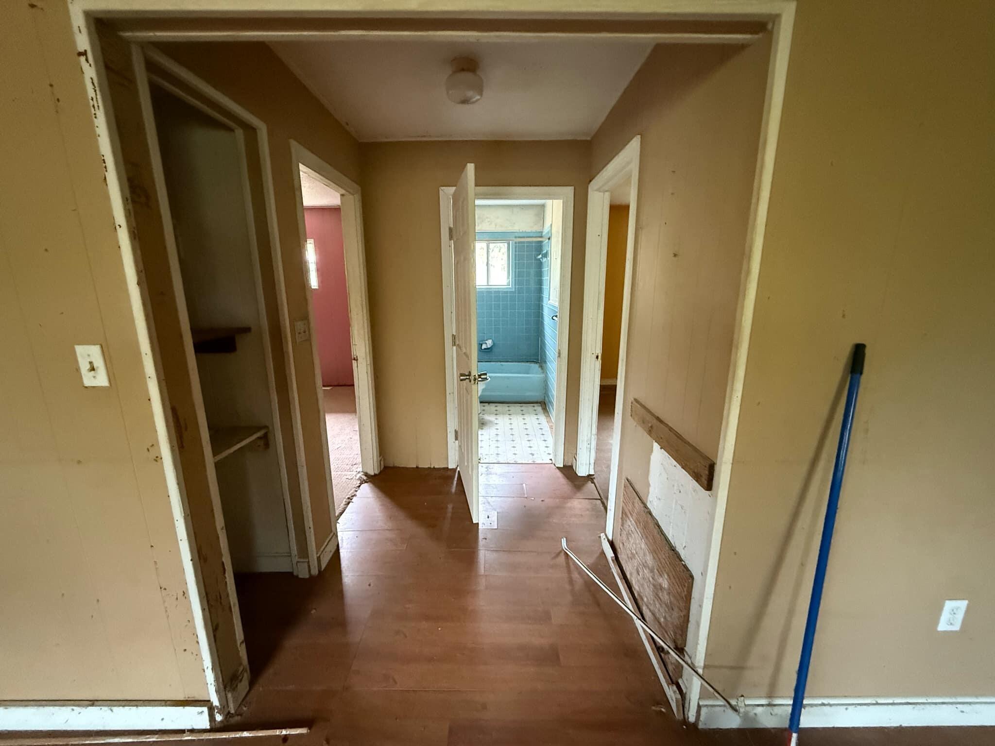1951 Caton Road Florala, AL 36442 - Photo 13 of 34 a view of a hallway with wooden floor and staircase