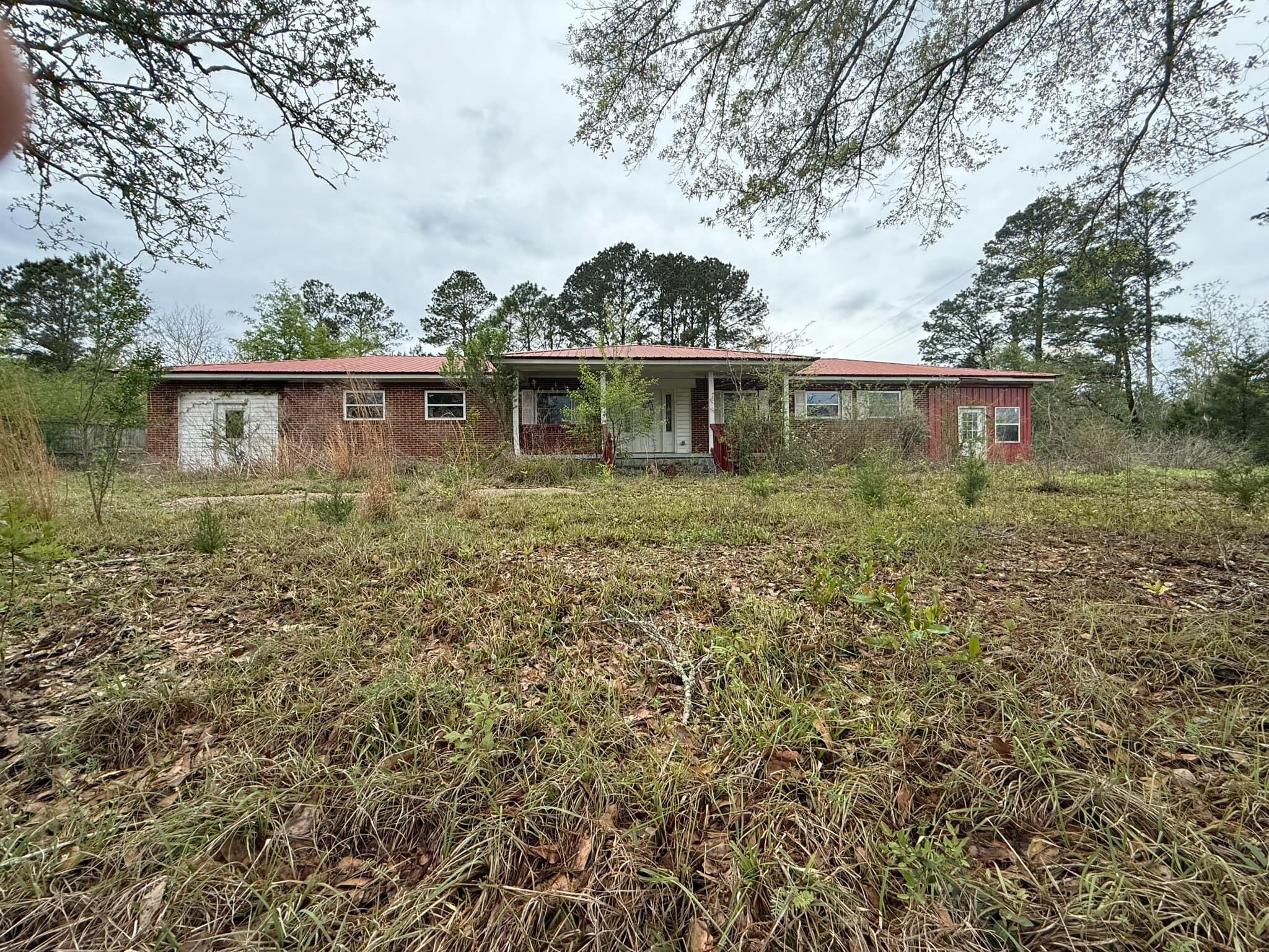 1951 Caton Road Florala, AL 36442 - Photo 2 of 34 front view of house with a yard