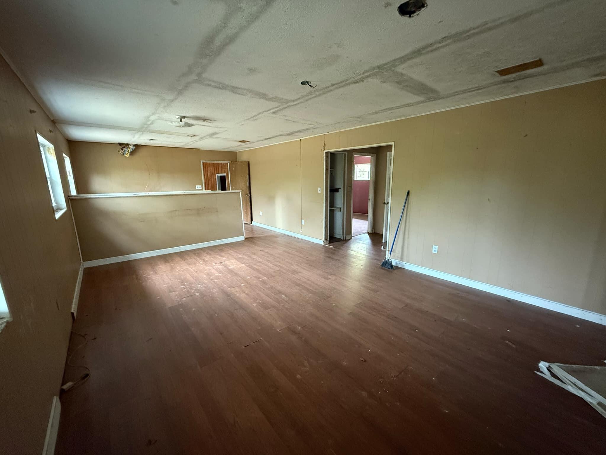 1951 Caton Road Florala, AL 36442 - Photo 23 of 34 wooden floor in an empty room with a window
