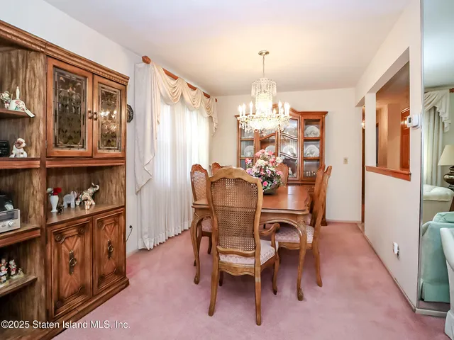 a bedroom with a bed and a table