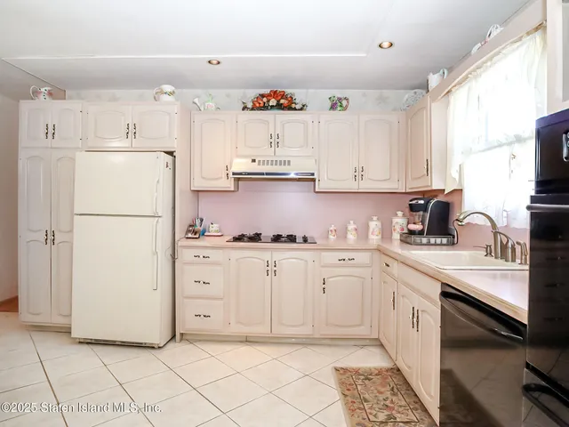 a view of a room with gym equipment and a window
