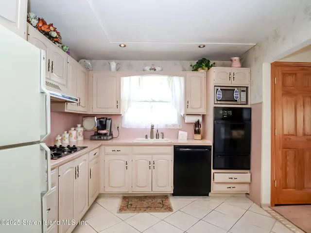 a bathroom with a toilet a sink and a mirror