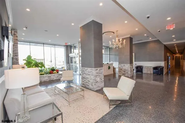a living room with fireplace furniture and a wooden floor