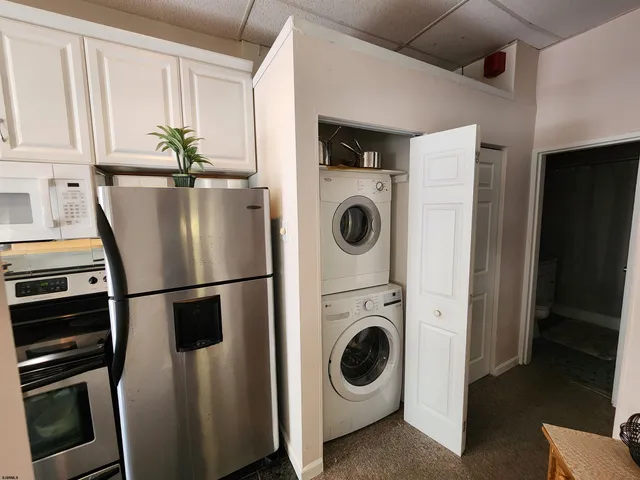a white refrigerator freezer sitting inside of a kitchen