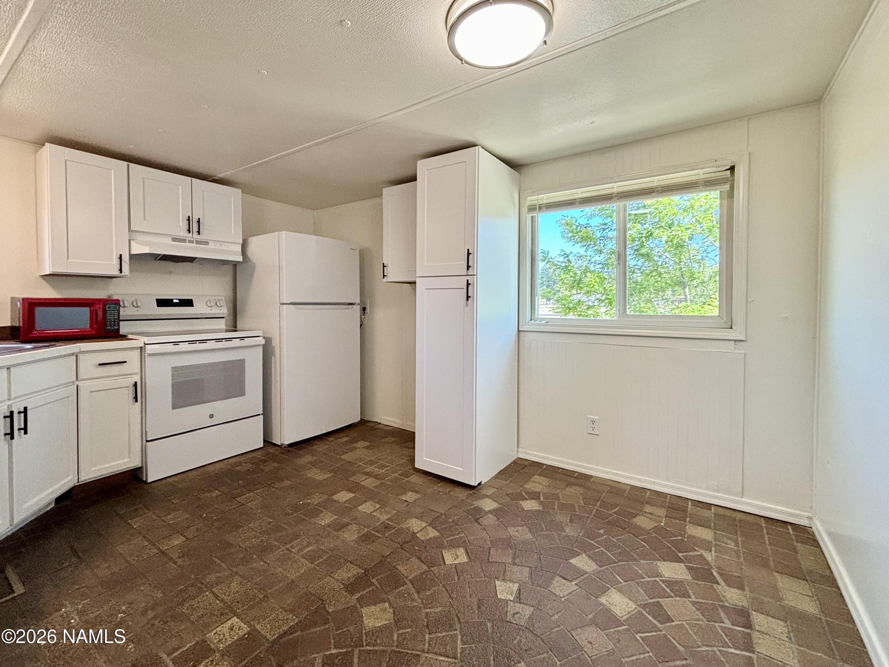 4805 South Thorn Road, Unit 1 Flagstaff, AZ 86005 - Photo 6 of 21 Open kitchen w/new appliances