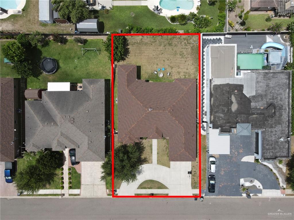 1605 East 30th Street Mission, TX 78574 - Photo 11 of 16 Drone / aerial view of a pool