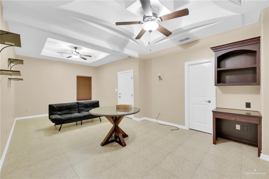 1605 East 30th Street Mission, TX 78574 - Photo 6 of 16 Living area featuring baseboards and a ceiling fan