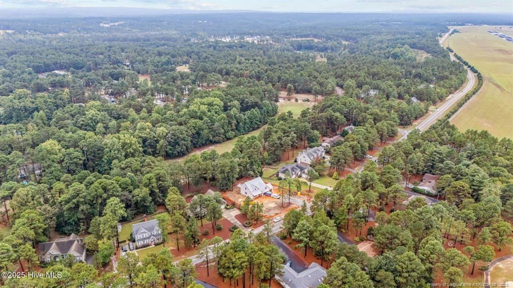 2177 Airport Road Whispering Pines, NC 28327 - Photo 12 of 15 an aerial view of house with yard and mountain view in back