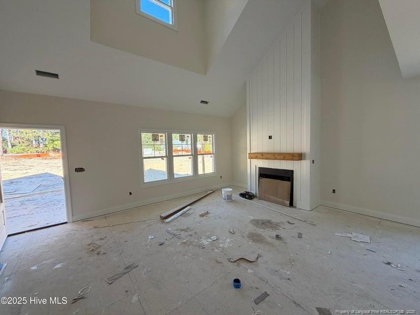 2177 Airport Road Whispering Pines, NC 28327 - Photo 3 of 15 a view of a livingroom with a fireplace
