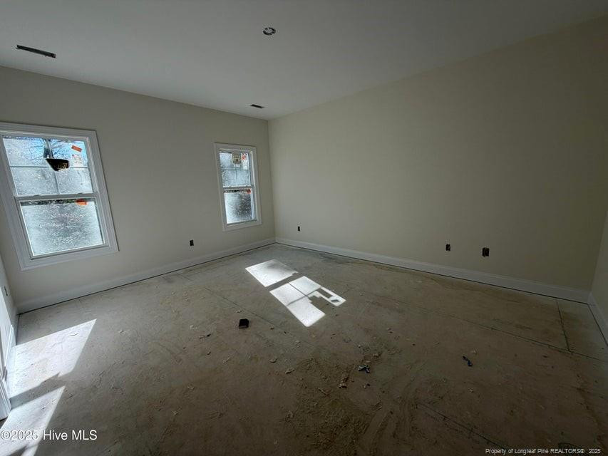 2177 Airport Road Whispering Pines, NC 28327 - Photo 10 of 15 an empty room with a window
