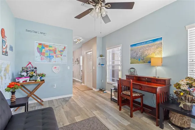 a view of a workspace with furniture and toys