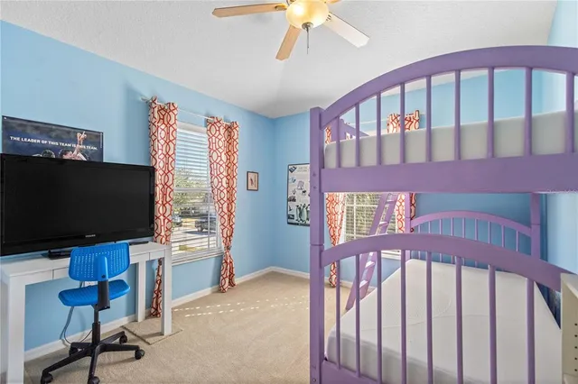 a view of a livingroom with workspace and a window