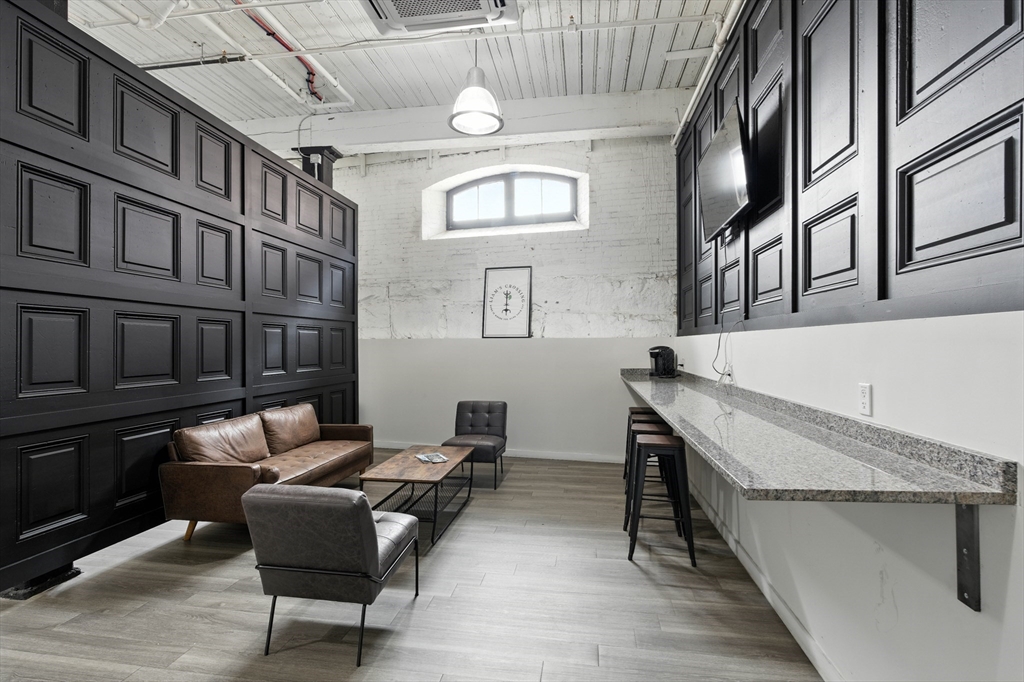 55 Sterling Street, Unit 306 Clinton, MA 01510 - Photo 22 of 32 a view of a livingroom with furniture and window