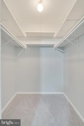 a view of an empty walk in closet