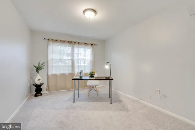 a workspace with furniture and a window