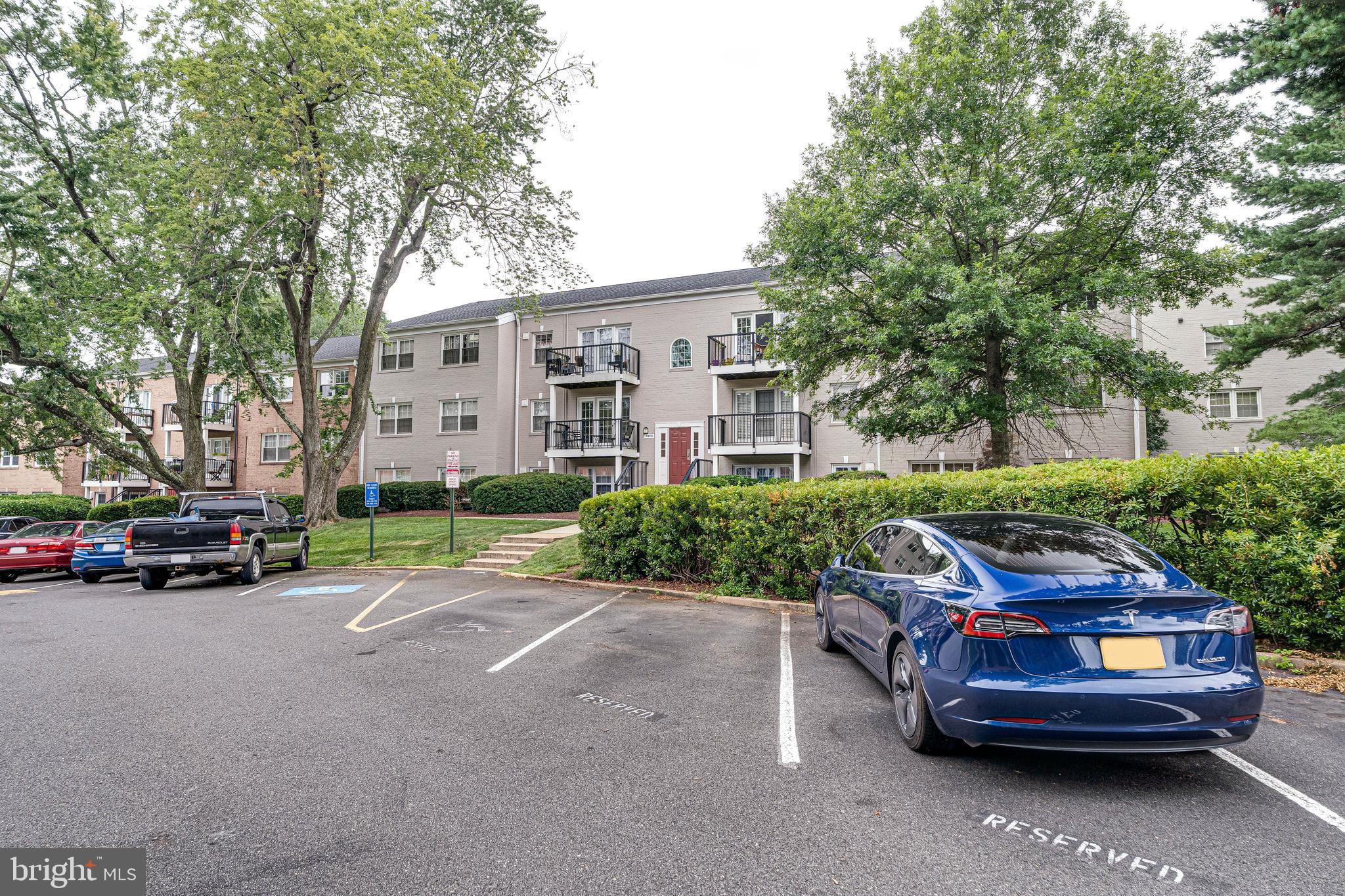 9473 Fairfax Boulevard, Unit 104 Fairfax, VA 22031 - Photo 2 of 32 a view of a car parked in front of a house