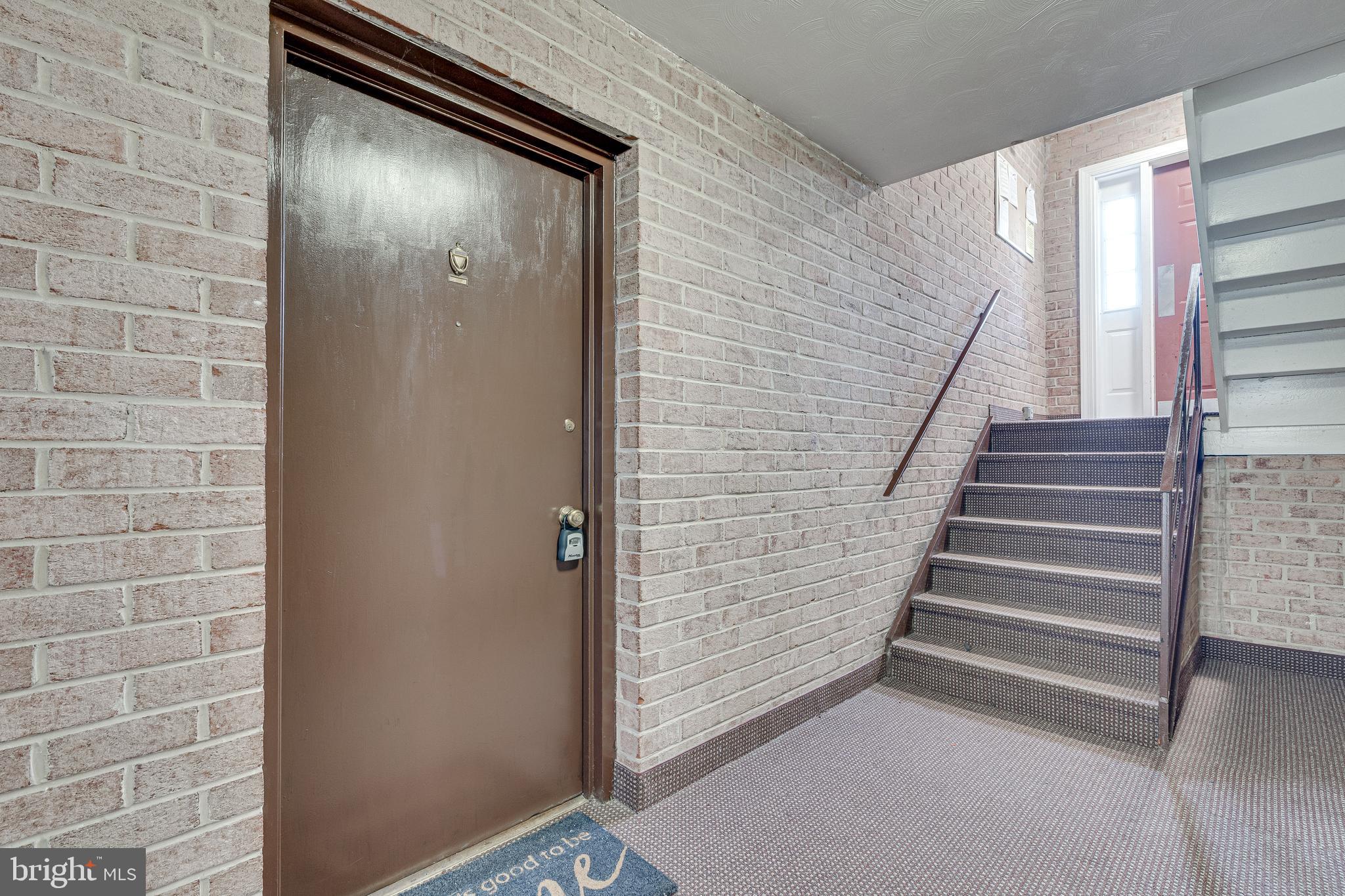 9473 Fairfax Boulevard, Unit 104 Fairfax, VA 22031 - Photo 22 of 32 a view of entryway with stairs
