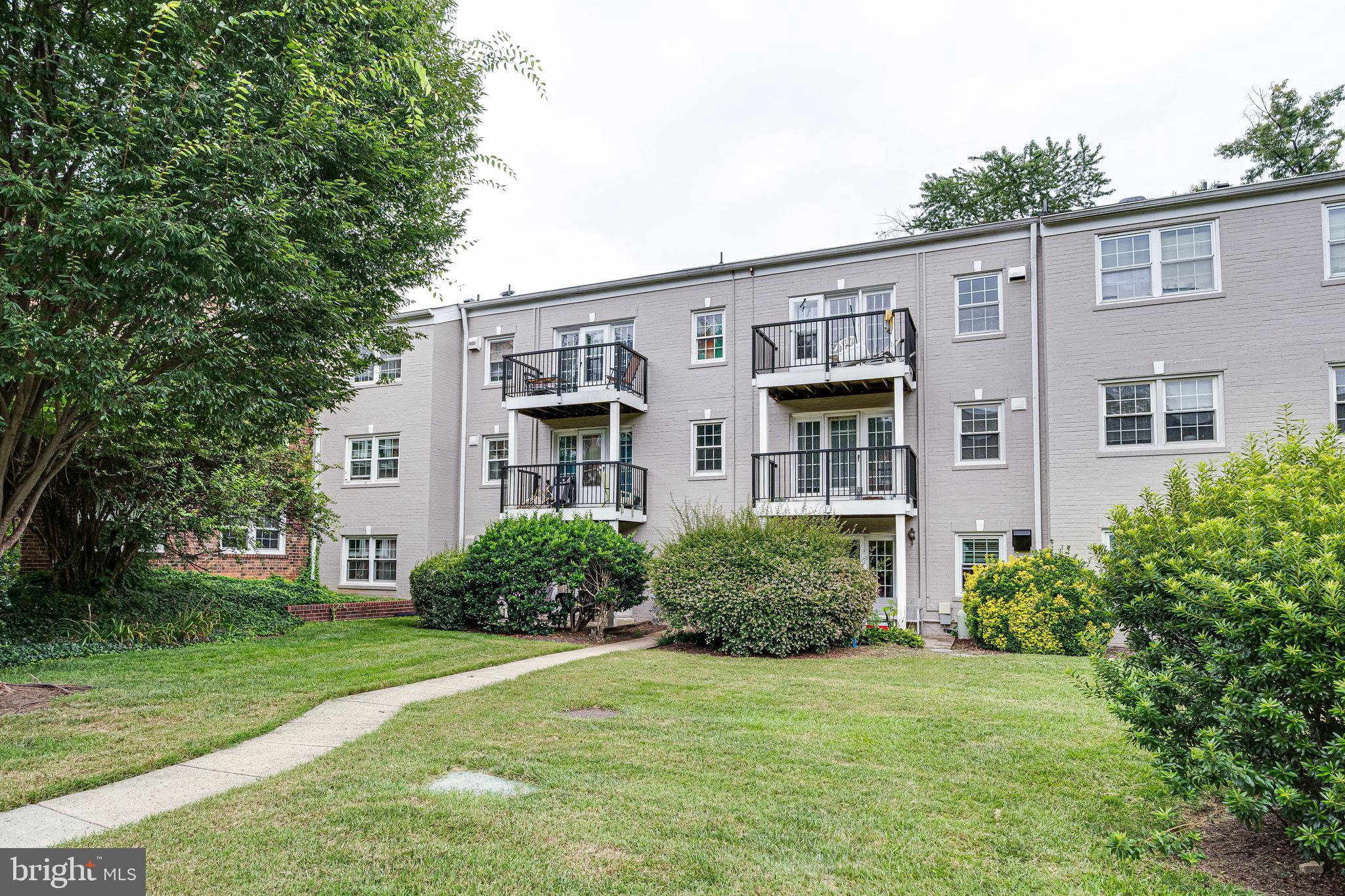 9473 Fairfax Boulevard, Unit 104 Fairfax, VA 22031 - Photo 24 of 32 front view of a house with a yard