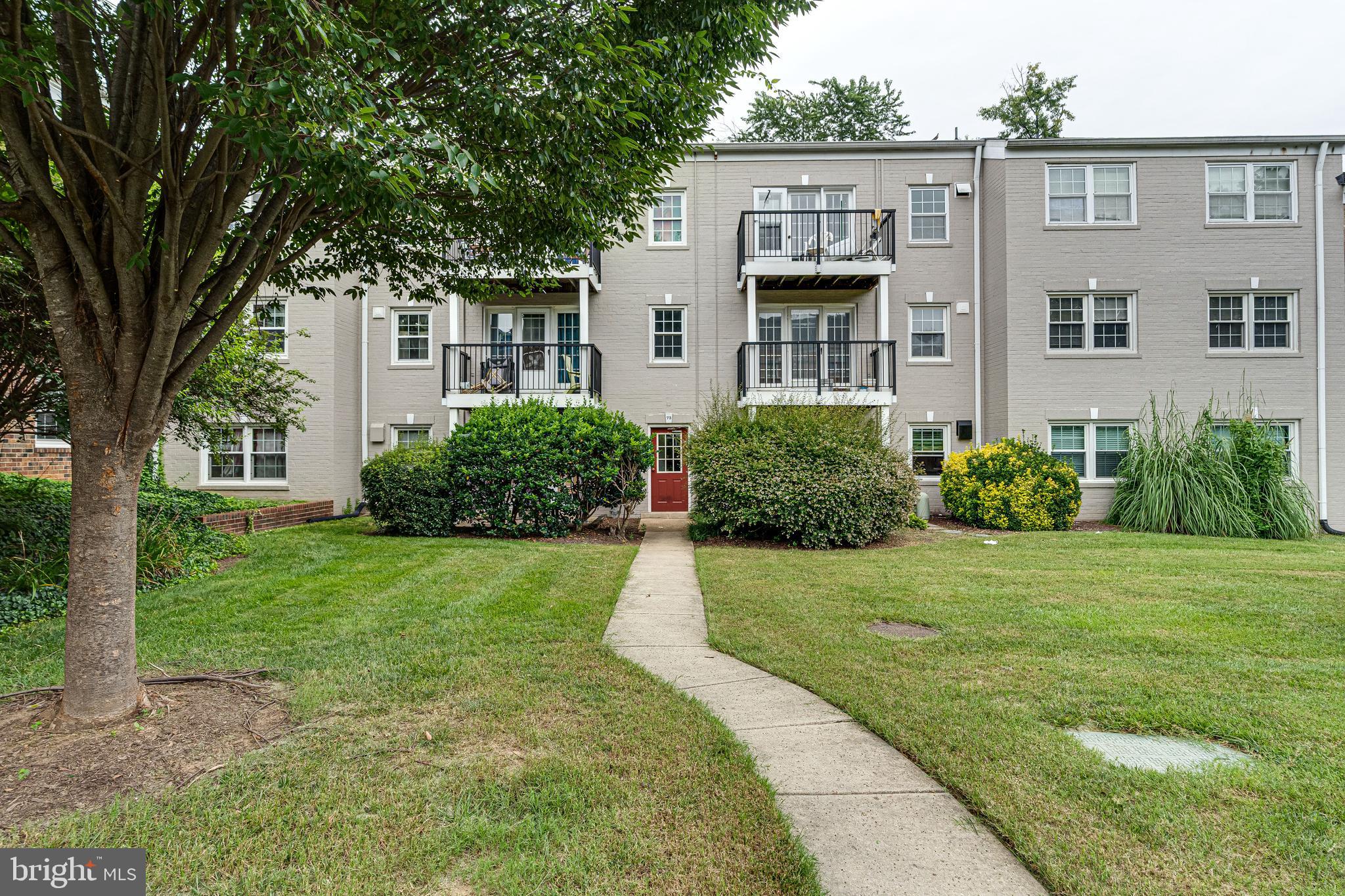 9473 Fairfax Boulevard, Unit 104 Fairfax, VA 22031 - Photo 25 of 32 front view of a house with a yard