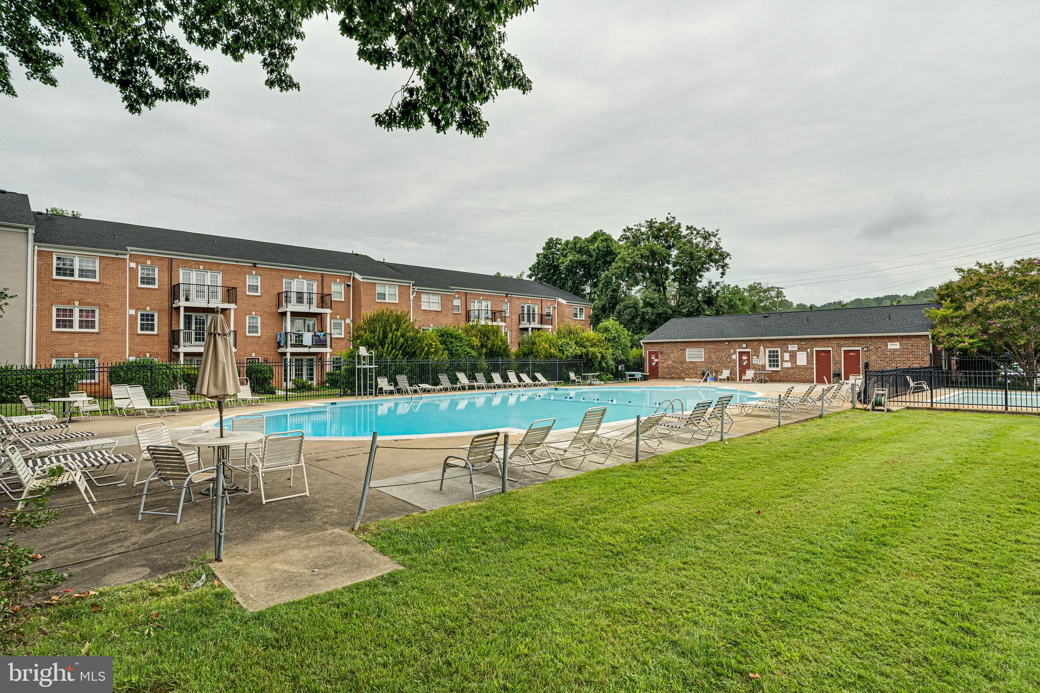 9473 Fairfax Boulevard, Unit 104 Fairfax, VA 22031 - Photo 27 of 32 a view of a swimming pool with a patio