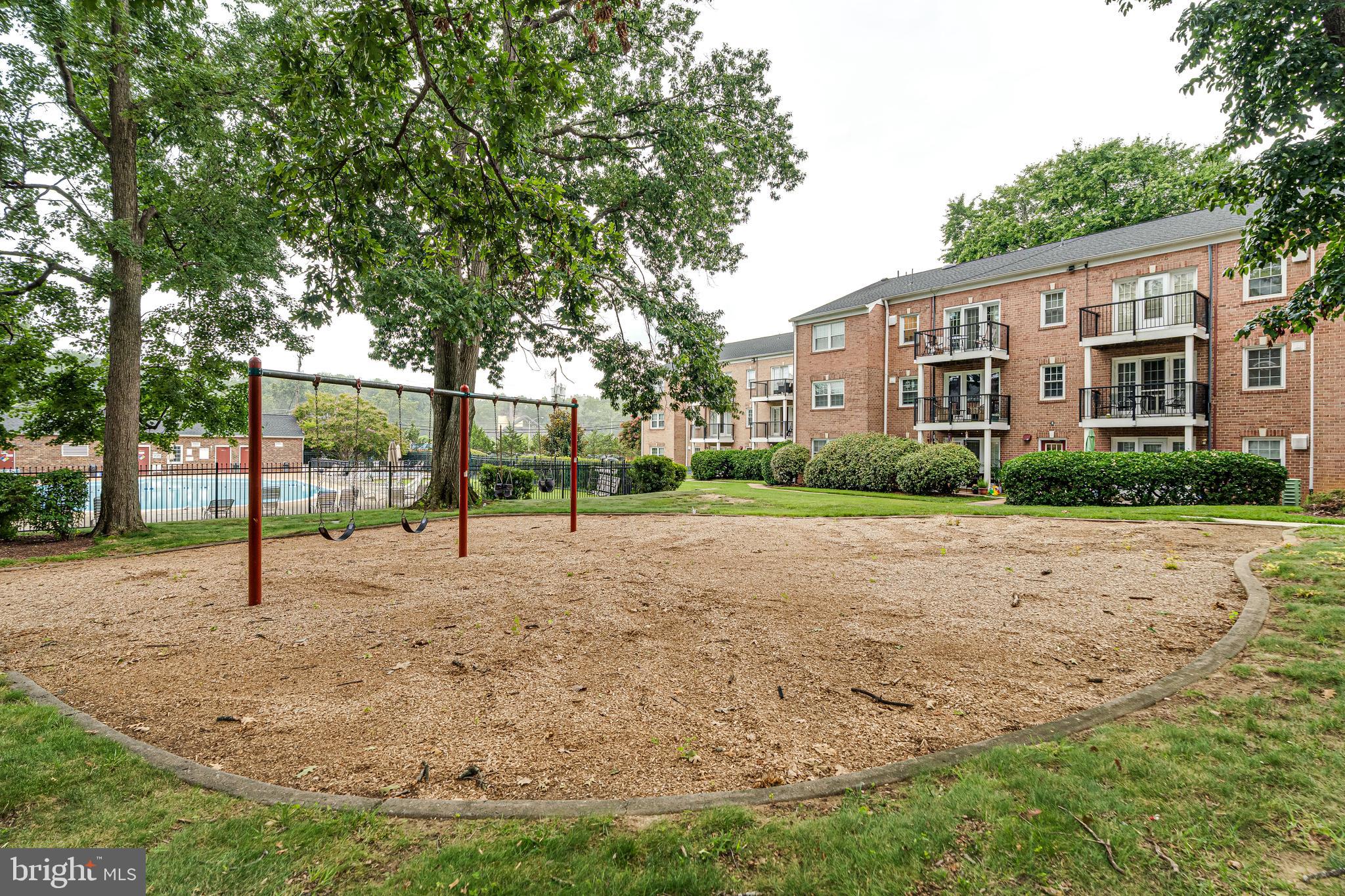 9473 Fairfax Boulevard, Unit 104 Fairfax, VA 22031 - Photo 29 of 32 a view of a house with a park