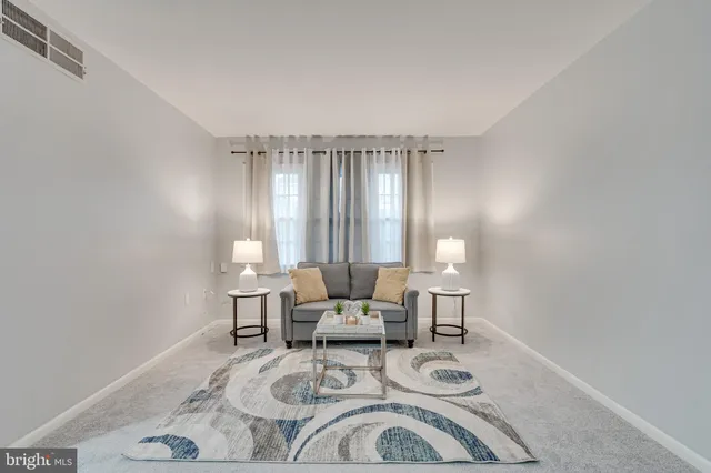 a living room with furniture and window