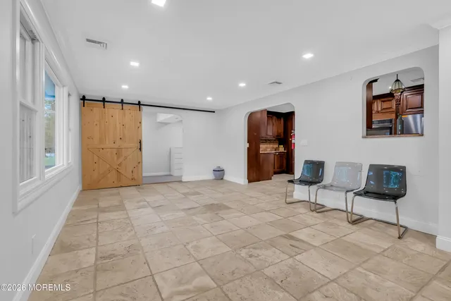 a bed sitting in a room next to a window