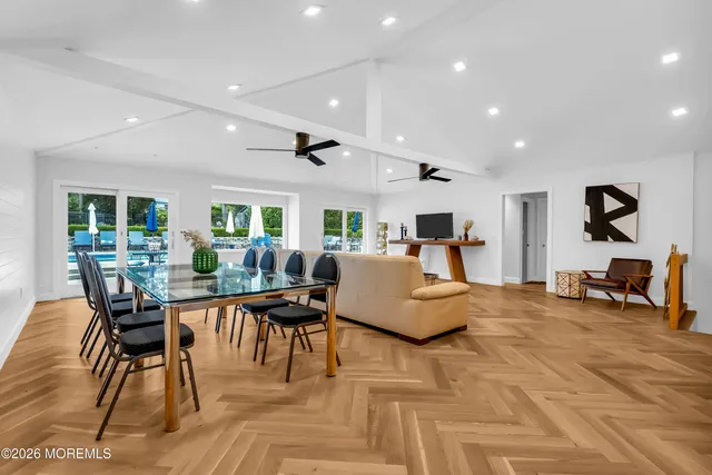 a kitchen with stainless steel appliances granite countertop a refrigerator a sink and a stove