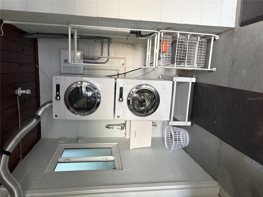 421 Riviera Street Venice, FL 34285 - Photo 28 of 30 a view of a hallway with washer and dryer