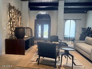 9545 East Romping Road, Unit 90 Carefree, AZ 85377 - Photo 5 of 32 a living room with furniture and a wooden floor