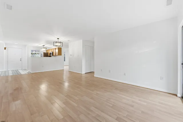 a view of a big room with wooden floor