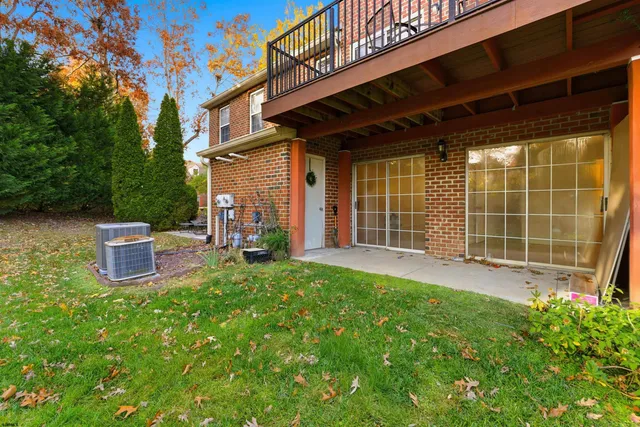 a view of a patio with table and chairs and potted plants