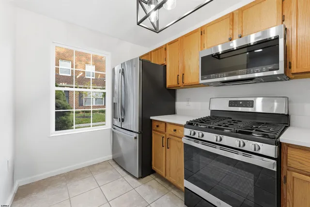 a kitchen with a stove microwave and refrigerator