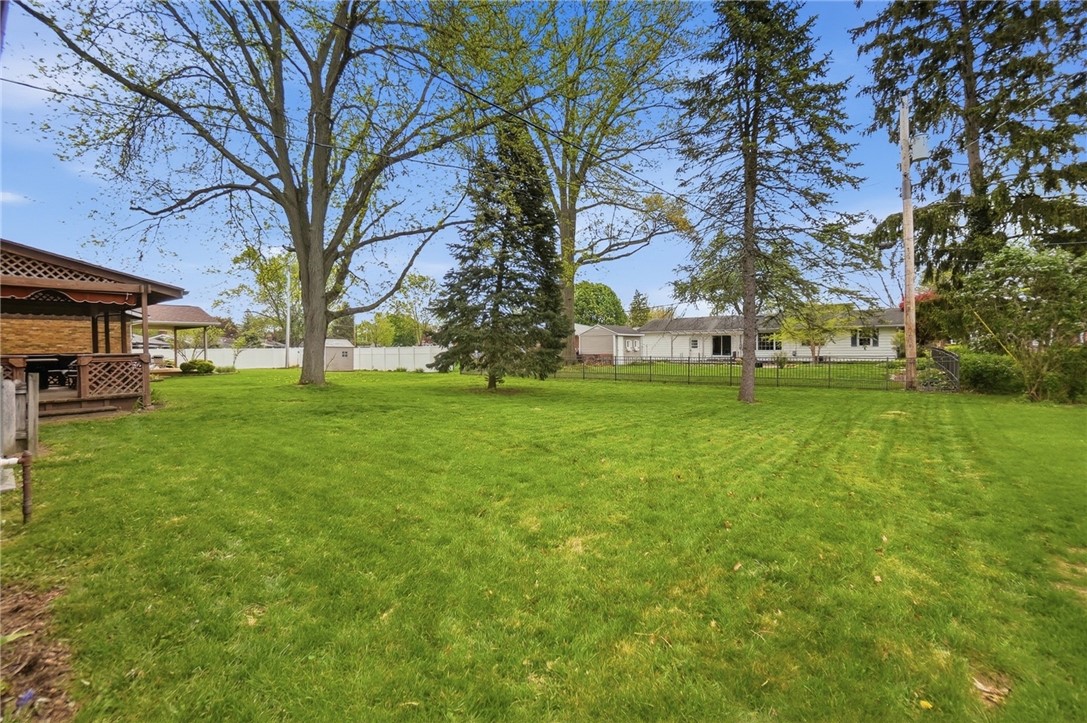150 Littlejohn Road Troy, OH 45373 - Photo 40 of 40 Expansive green space offers a serene private yard, perfect for outdoor living.