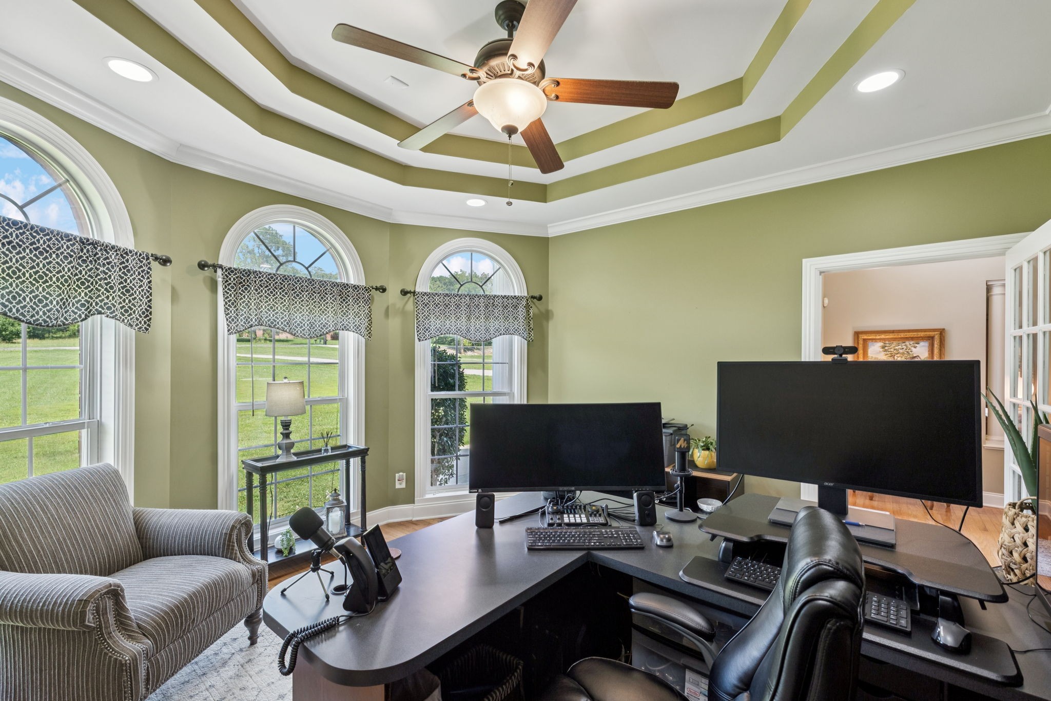 3056 Southeast Tater Peeler Road Lebanon, TN 37090 - Photo 12 of 100 a work room with furniture and a flat screen tv